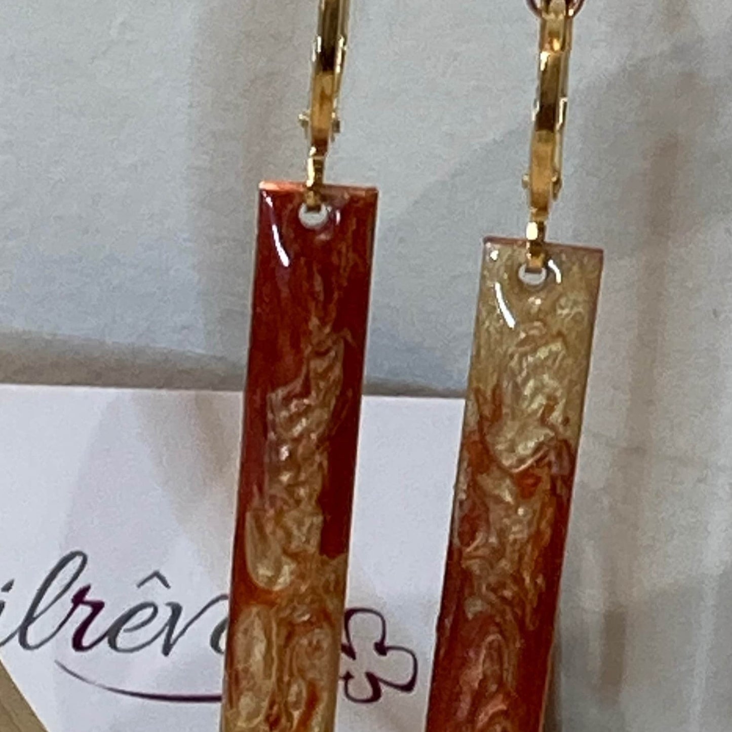 Rectangular red-gold copper earrings, embellished with a small crystal.