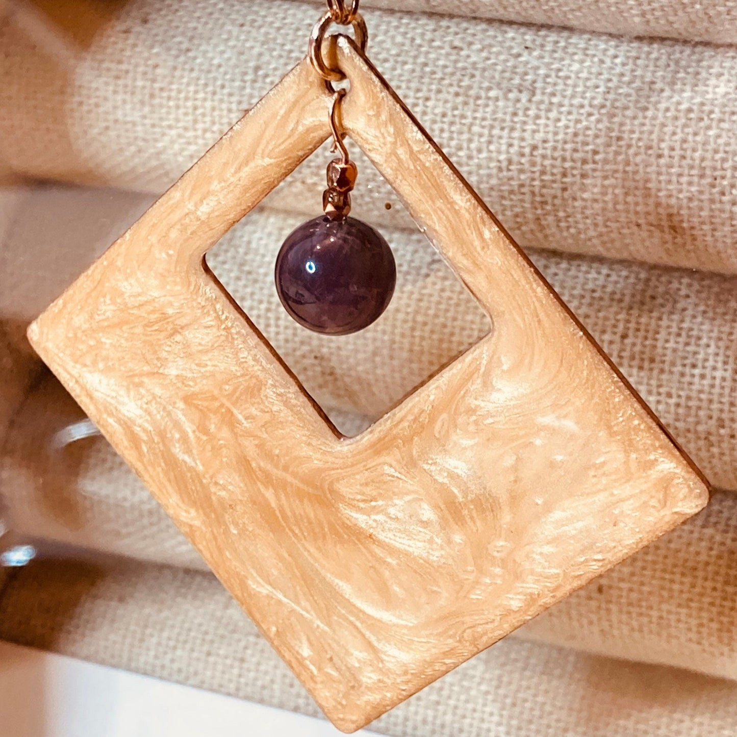 Copper necklace with square pendant, embellished with amethyst pearl.