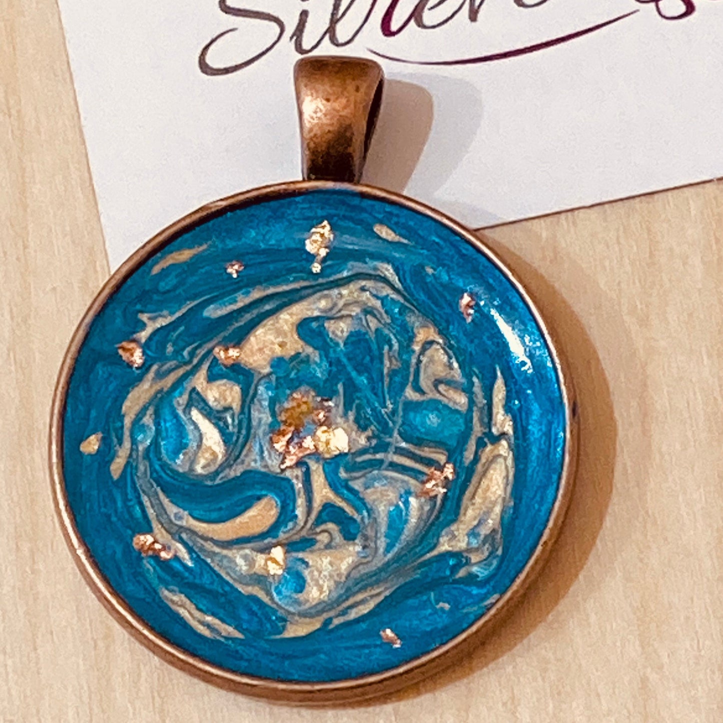 Copper necklace with round pendant, hand painted and vitrified.