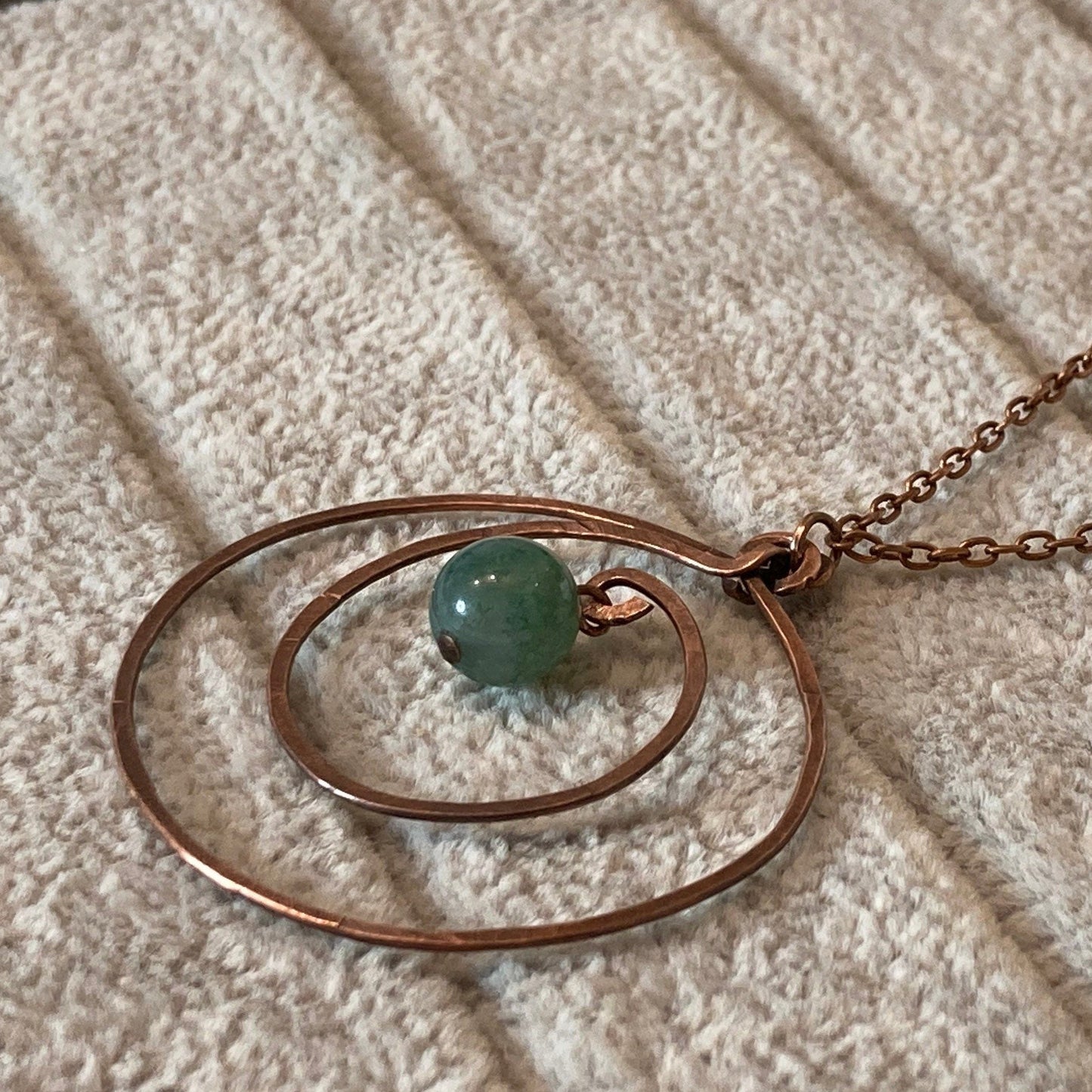 Hammered and antiqued copper pendant, with green agate