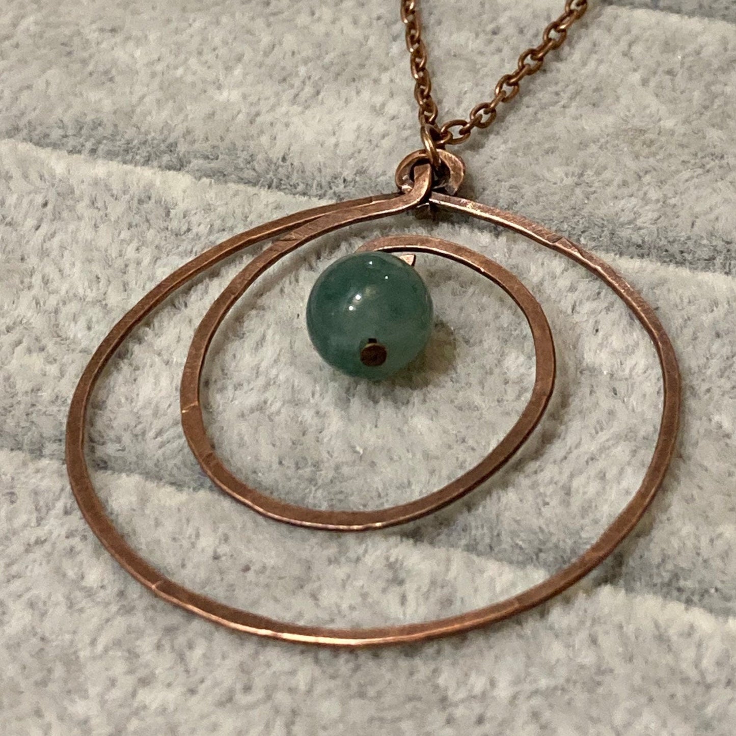 Hammered and antiqued copper pendant, with green agate